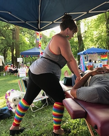 massage therapist working outside at Tower Grove Pride